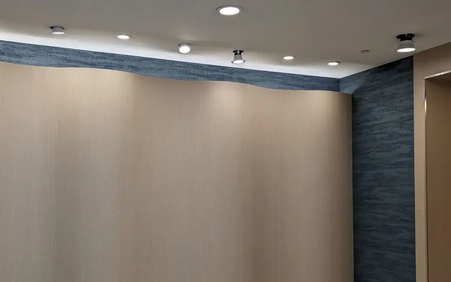 Curved lobby feature wall wrapped in ZX162 Blonde Oak film